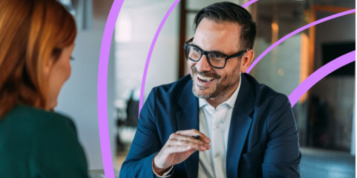 Man speaking to woman in office