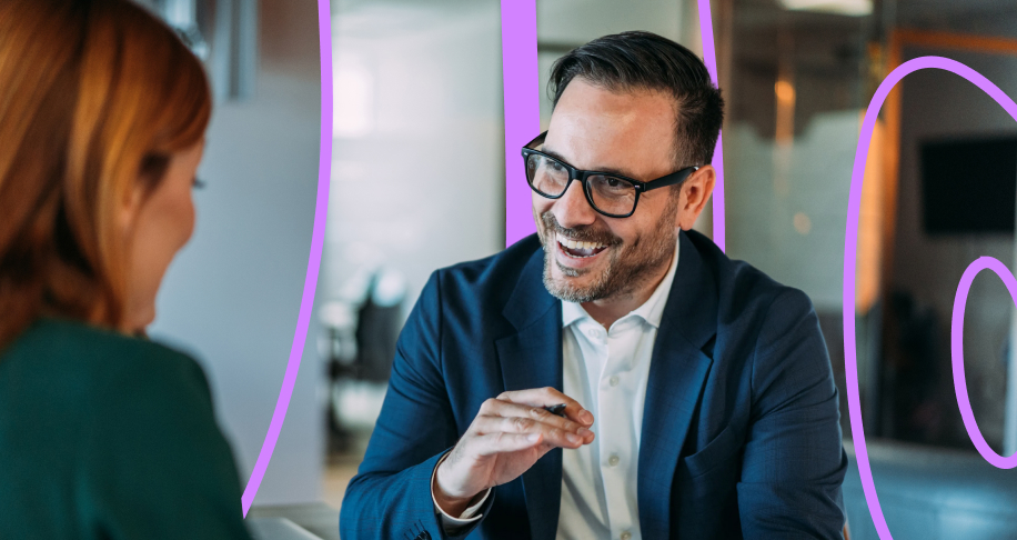 Man wearing glasses, speaking to client