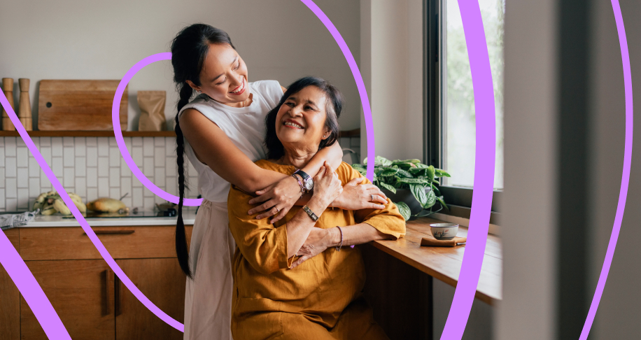 Woman hugging mother from behind